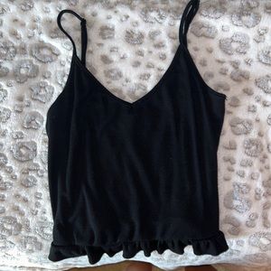 Black tank top with ruffles at the bottom.